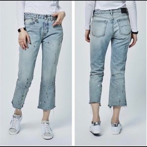 R13's Kick Fit Cropped Jeans are distressed and feature
a raw hem.